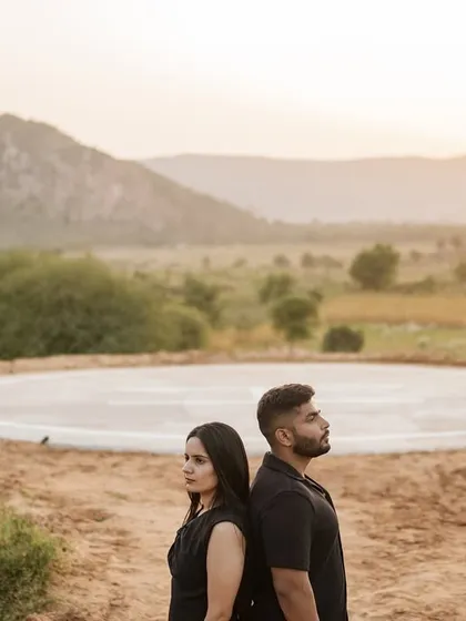 A dramatic pose on a helipad in a rustic, hilly landscape. We are always looking for unique locations and compositions to make your pre-wedding photos stand out.