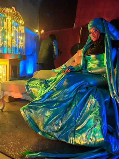 A performer in a stunning, iridescent blue costume at the 'Avatar' party. We use theatrical elements and performers to fully realize our creative event concepts.