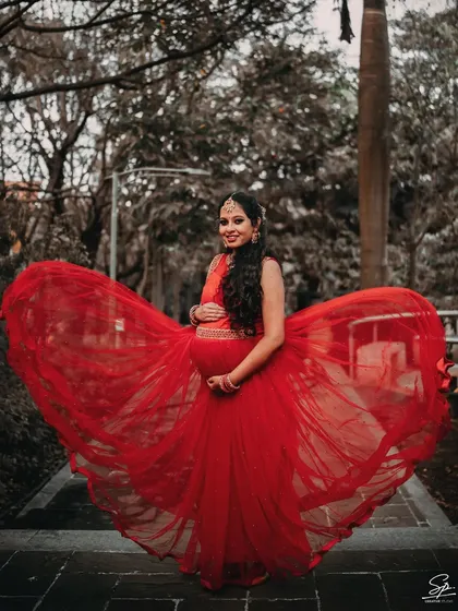 A maternity photoshoot should be as powerful and beautiful as the journey itself. I use dramatic elements like this flowing red gown to create elegant, artistic portraits that celebrate the mom-to-be with grace and style.