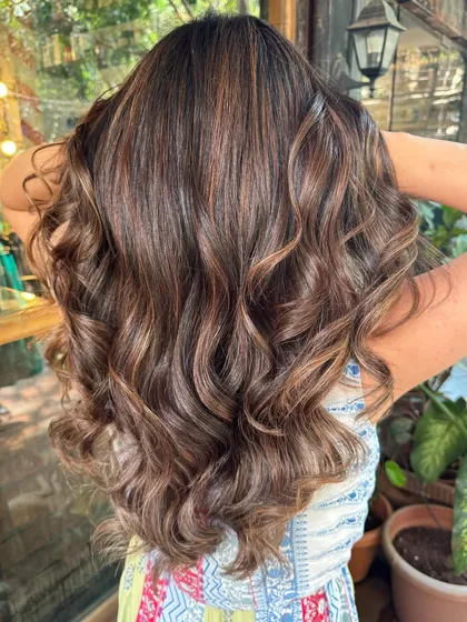 The back view of this 'Espresso' look. The rich brown color is deep and glossy, and the waves show off the subtle highlights.
