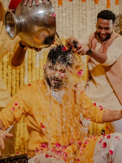 When the groomsmen decide it's their turn! Capturing the groom getting lovingly doused by his friends is always a highlight.