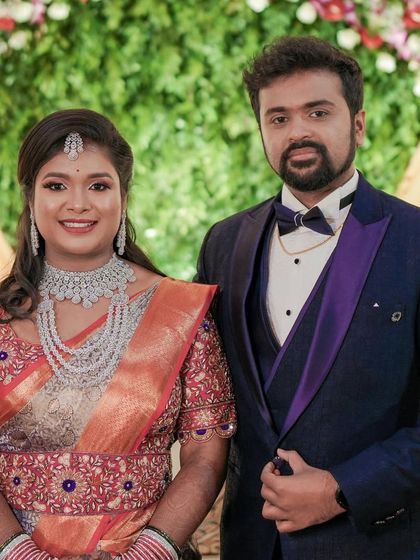 The happy couple at their reception. Sheethal's sparkling jewellery adds to the celebratory atmosphere.