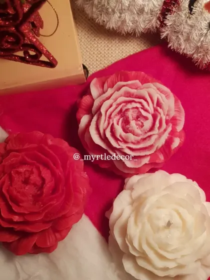 Our Peony candles in festive red and white, perfect for adding a touch of floral elegance to your Christmas decor. The intricate petals look beautiful in the warm glow of holiday lights.