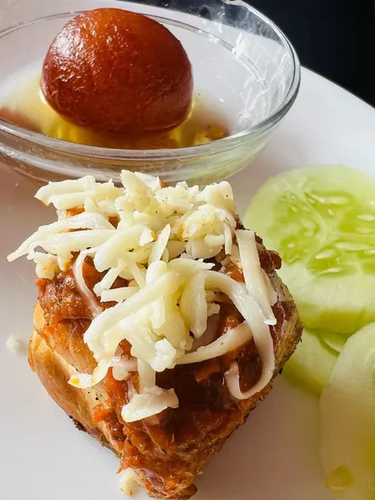 An innovative starter I created: Pav Bhaji Shots. This dish deconstructs the classic street food into a single, flavour-packed bite, topped with cheese and served with a mini pav.