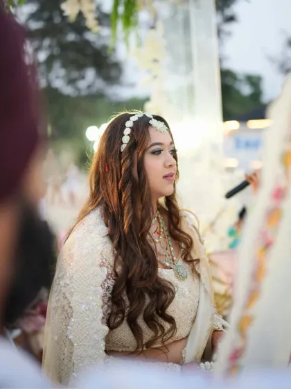 A candid shot of the bride during her Goa wedding ceremony. Her makeup is fresh and glowing, perfect for a sunny, outdoor event.