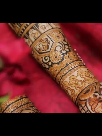 A close-up of a custom forearm design featuring adorable portraits of the couple's pets. It's a sweet and personal touch for any animal lover.