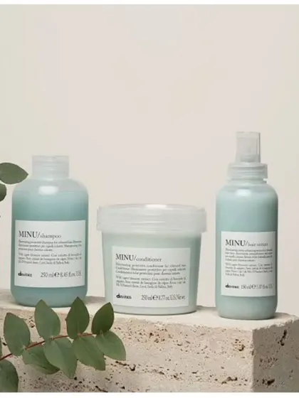 The Davines MINU line, including a shampoo, conditioner, and hair serum, is specifically designed to protect and illuminate colored hair, keeping it vibrant for longer.