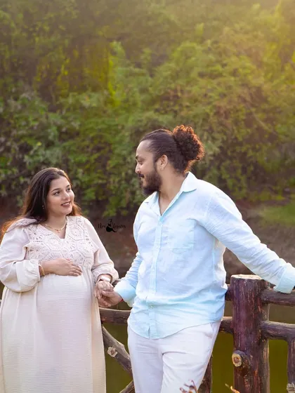 A happy, relaxed portrait of the couple holding hands during their outdoor maternity session. Their comfortable and natural interaction is exactly what we aim to capture in our photography.