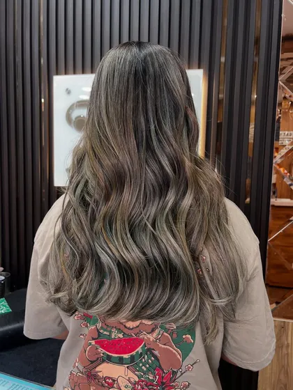 A cool-toned balayage with ashy blonde and brown shades. This look is perfect for anyone wanting a modern, sophisticated color that isn't too warm.