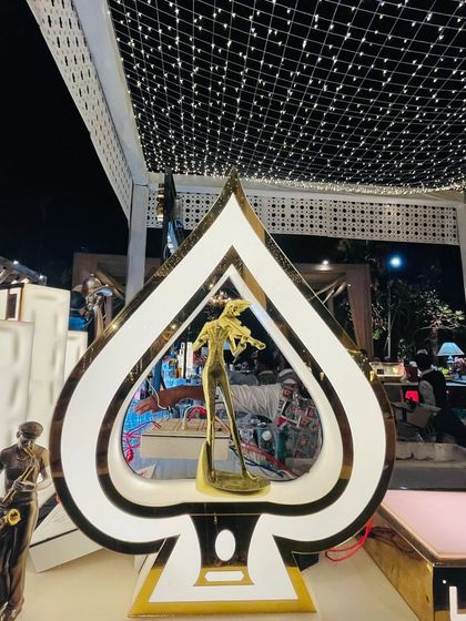 A unique spade-shaped decor piece, adding a touch of casino-night glamour to this Art Deco bar.