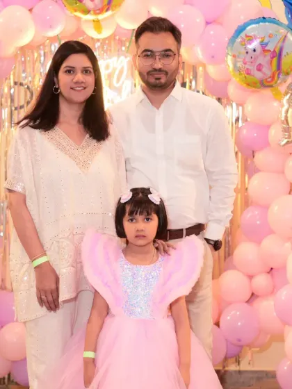 A family portrait from a princess-themed birthday party.
