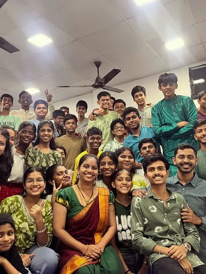 A beautiful group photo with students and teachers dressed in green for Day 5 of Navratri, representing growth and harmony.