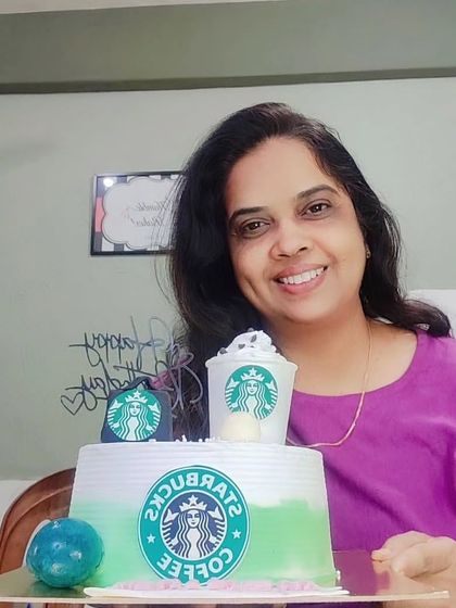 Me with the Starbucks themed cake, ready for delivery.