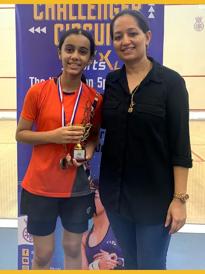 Another rising star from the Challenger Circuit 2023, proudly showcasing her hard-earned trophy and medal.