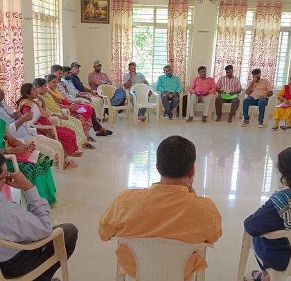 The group sits in a circle for a reflective discussion, a practice we encourage to build community and shared understanding among educators.