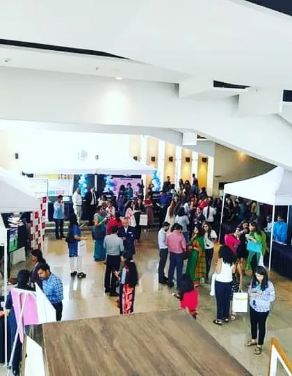 We can transform large halls into dynamic exhibition spaces. This high-angle view of the National Educational Expo for Klay Preschools shows our expertise in setting up structured layouts with tents, booths, and clear pathways for high visitor traffic.