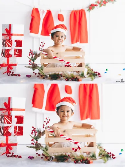 A cheerful portrait from our holiday-themed shoot. The setup includes a stack of presents and a miniature Santa suit, creating a clean and festive look for this little boy's photo.