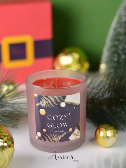 The 'Cozy Glow' jar candle, with its warm vanilla and cinnamon scent, is perfect for creating a cozy holiday atmosphere.