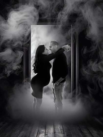 A creative and moody couple's portrait using a frame and smoke effect. This editorial style is for couples looking for something artistic and dramatic.
