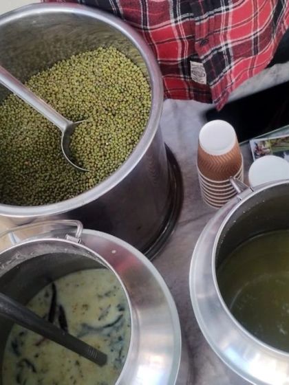 Containers of fresh breakfast items like sprouted moong salad and raita, ready to be served.