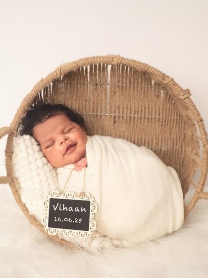 A classic newborn shot in a rustic basket. The chalkboard with the baby's name and birthdate is a lovely way to personalize the photo.
