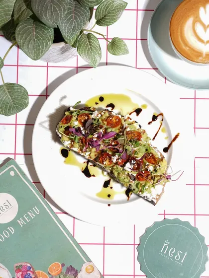 A classic overhead shot is perfect for showcasing cafe dishes like this avocado toast. I focus on bright, natural lighting and careful composition with menu branding to create a clean, appetizing image that’s ideal for menus and Instagram feeds.