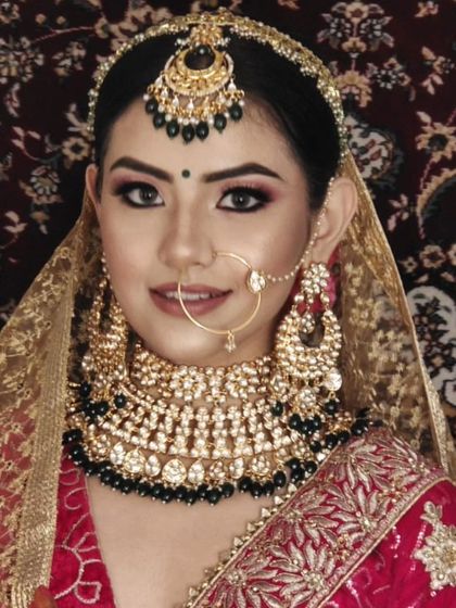 A bride wearing a heavy choker with black beads, offering a bold and unconventional bridal look. I can customize bead colors to your preference.