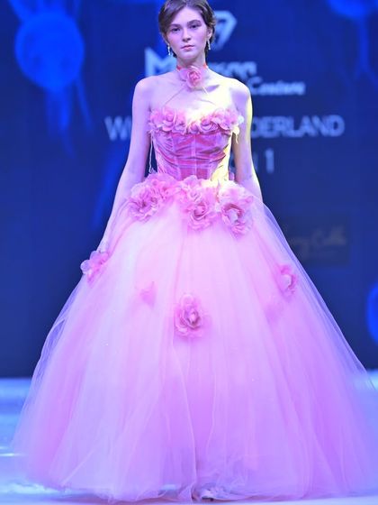 A full view of the pink floral ball gown, complete with a matching floral choker. It's a design straight out of a storybook.