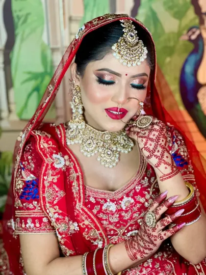 A beautiful smile completes the look. The makeup is designed to be long-lasting and radiant, keeping the bride looking fresh throughout her special day.