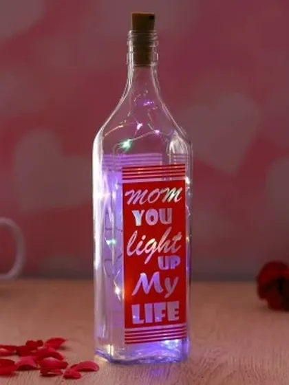 A beautiful way to tell your mom she lights up your life. This personalized bottle lamp contains fairy lights and a custom message, all housed within a stylish glass bottle with a cork stopper.