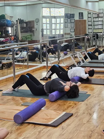 A class using foam rollers and mini stability balls to challenge their core and work on spinal alignment.