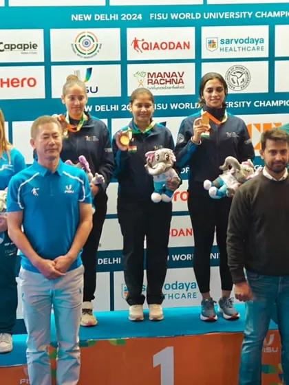 The winning teams of the 25M Pistol Women Team event, with Team India taking Gold. We are committed to promoting women's sports and celebrating their victories.