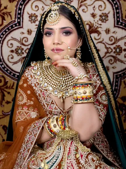 I also offer traditional looks like this heavy Marwari-style bridal lehenga. The rich colours and intricate gota patti work are perfect for a bride wanting a classic, regal look for her wedding.