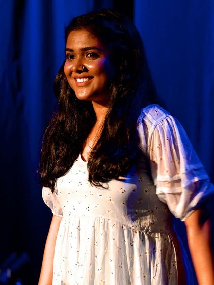 A smiling shot on stage. I may have oily skin, but the glow is also from the pure joy of performing.