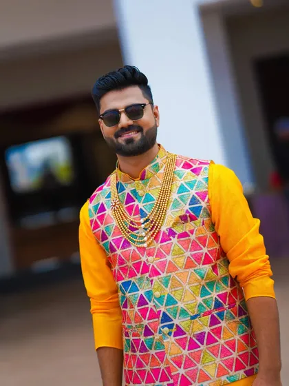 A vibrant Haldi look. The groom's colorful waistcoat is the star of the show, perfectly suited for this joyous occasion.