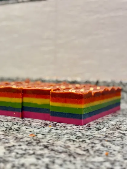 The side profile of our custom Rainbow soap, showing off all the colorful layers.