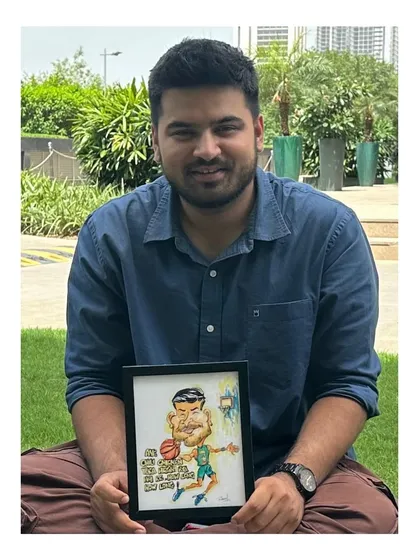 Another happy customer with his basketball-themed caricature. It’s great to see the final framed piece with the person who inspired it.