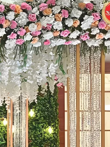 Another detailed view of the floral and crystal canopy, highlighting the beautiful craftsmanship and the interplay of different textures and materials.