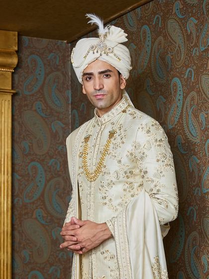 A closer look at the fine embroidery and the jeweled sarpech on the safa. These are the details that transform a garment into a cherished heirloom.