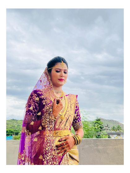 My beautiful Telugu bride, looking serene and divine for her muhurtham. The makeup highlights her features with a soft focus, paired with a classic updo and maang tikka.