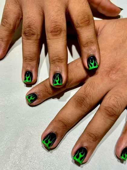 The full set of green flame nails. This look is all about confidence and attitude, proving that bold nail art is for everyone.
