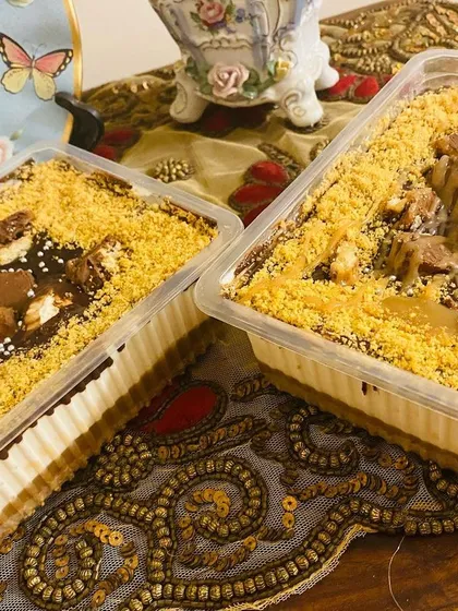 This is my bestseller, the Twixter. It's a creamy, no-bake chocolate and caramel dessert loaded with chunks of Twix chocolate bars, perfect for sharing.