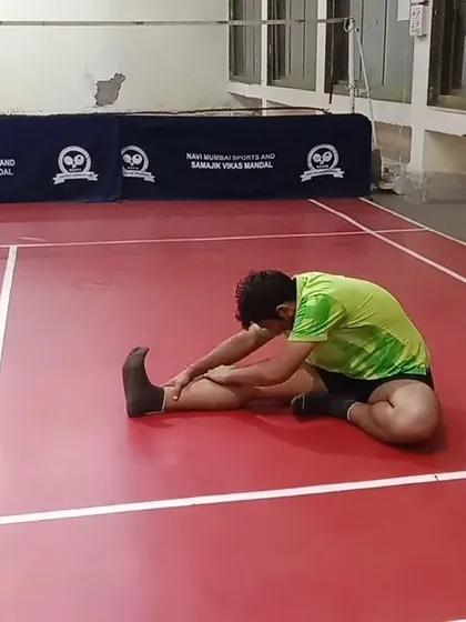 A seated forward bend helps to stretch the hamstrings and lower back. Maintaining flexibility in these areas is crucial for a low, athletic stance.