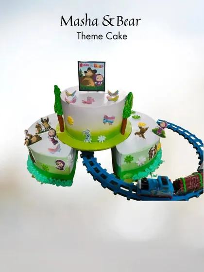 All aboard the celebration express! This Masha and the Bear theme cake features a real, moving toy train that circles the different cake sections. It’s an interactive design that keeps the kids entertained long after they've had their slice.