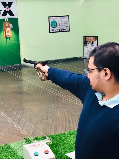 Every shooter gets the space they need to concentrate. Here, a student focuses on his target, applying the techniques learned during his coaching sessions.