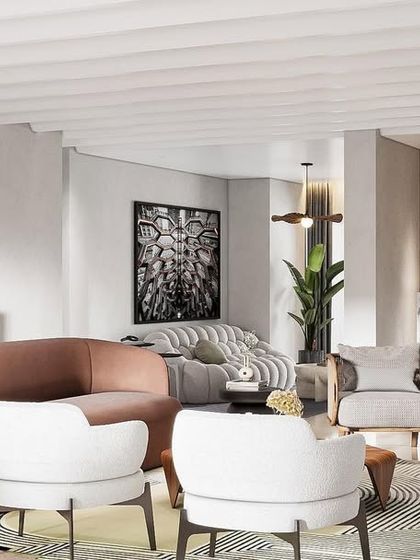 A living room that is rich, warm, and refined. The design blends classic and contemporary elements, with a curved dusty pink sofa, rattan-accented chair, and arched shelving to create a Parisian-meets-Indian vibe.