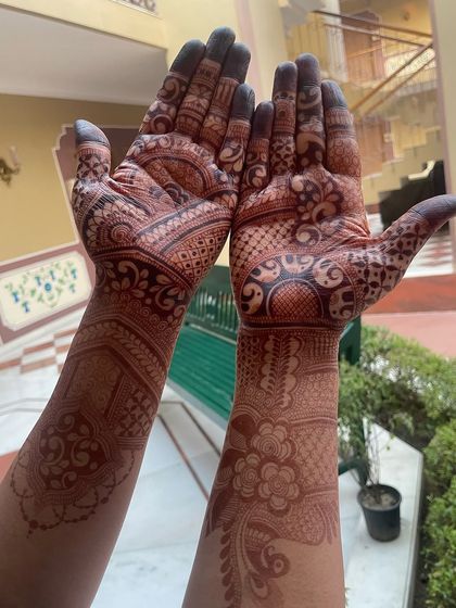 The rich, dark stain of a completed bridal mehandi, a few days after application.