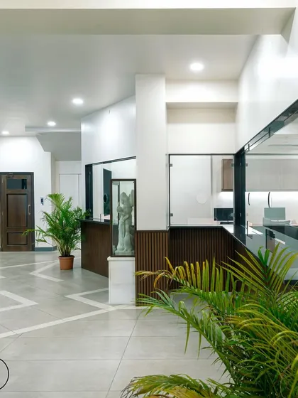 Another angle of the college reception, showing how the new design creates a professional and organized administrative space. The geometric floor pattern adds a dynamic element to the lobby.
