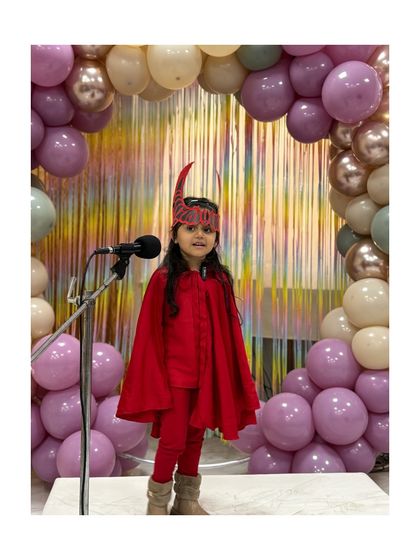 Dressed as the Scarlet Witch, this performer brings a touch of magic and mystery to her role.