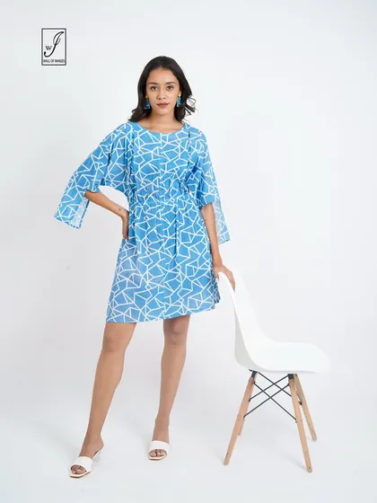 A clean and crisp e-commerce shot for a fashion brand's lookbook. The bright, even lighting on a simple white background ensures the focus is entirely on the product, showing the dress's pattern, fit, and details clearly.